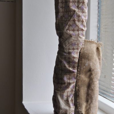 (L-R) Soap Tube II (Pillow) (2016) - soap, pillowcase; Soap Tube I (Sack) (2016) - soap, hessian